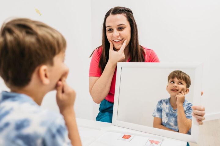 BillyLids Speech therapist teaching a child how to smile