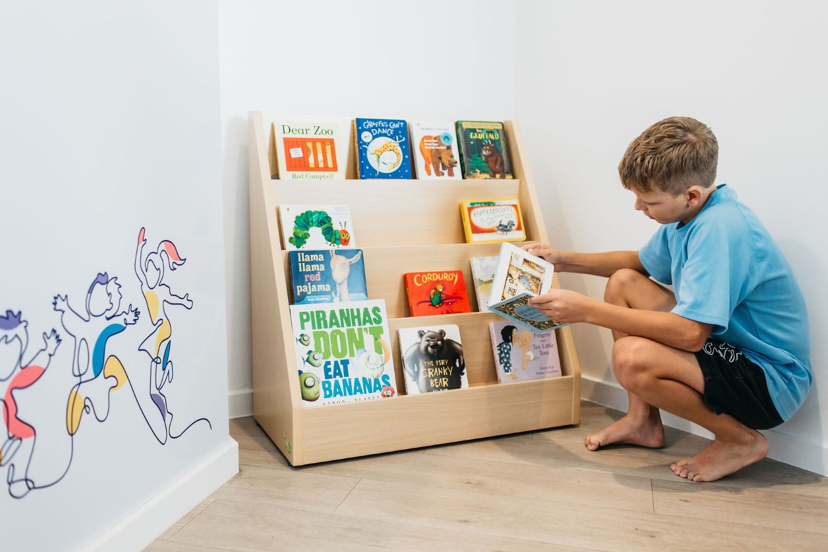 A child reading books at BillyLids Therapy