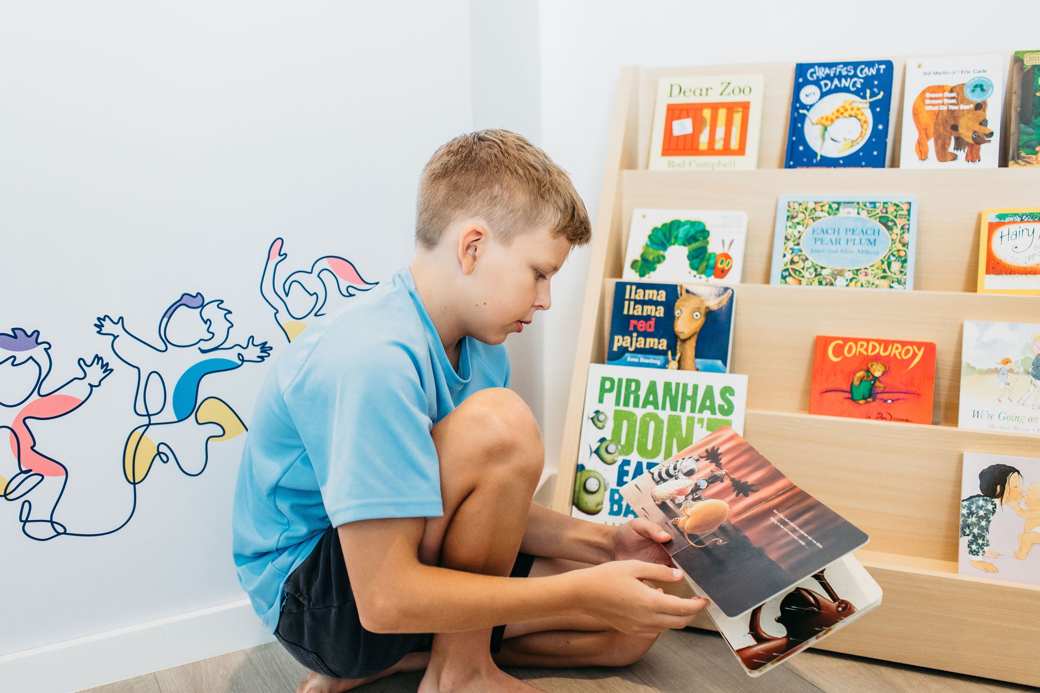 A child reading a book at BillyLid's Speech Pathology in Brisbane