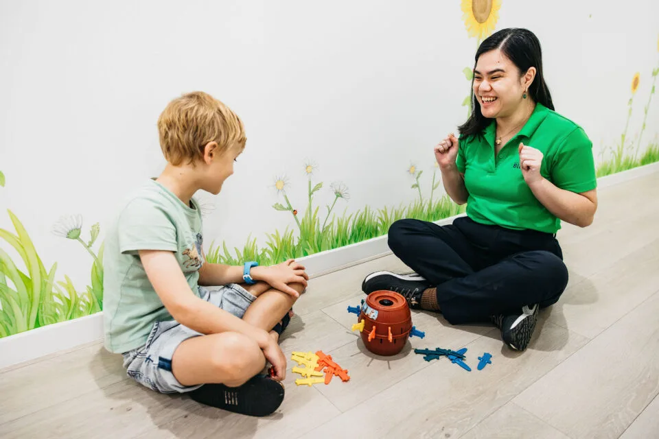 Minimal Pairs - a Parent’s Guide 3 Child playing with Pop Up Pirate in OT