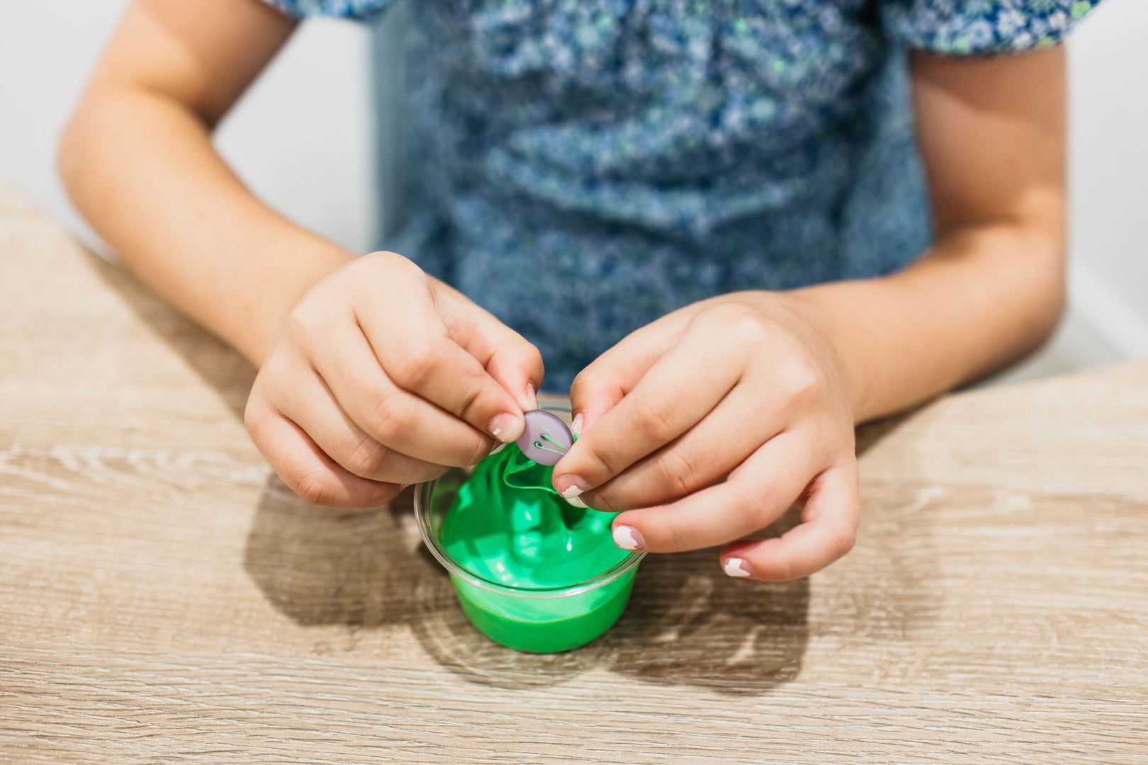 Child playing with puddy for ASD