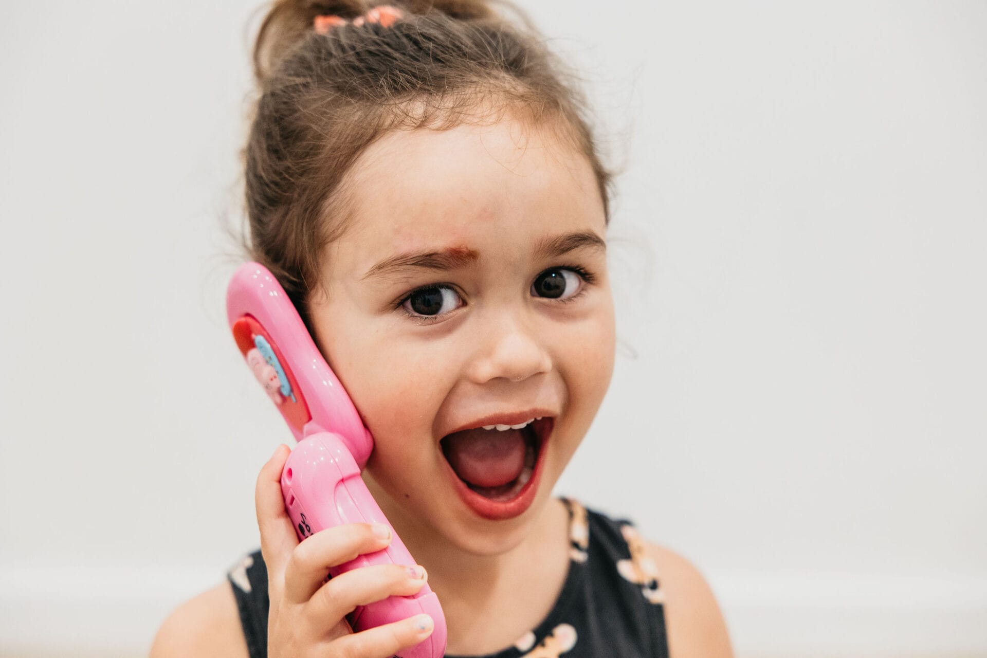 a child on a phone for language development