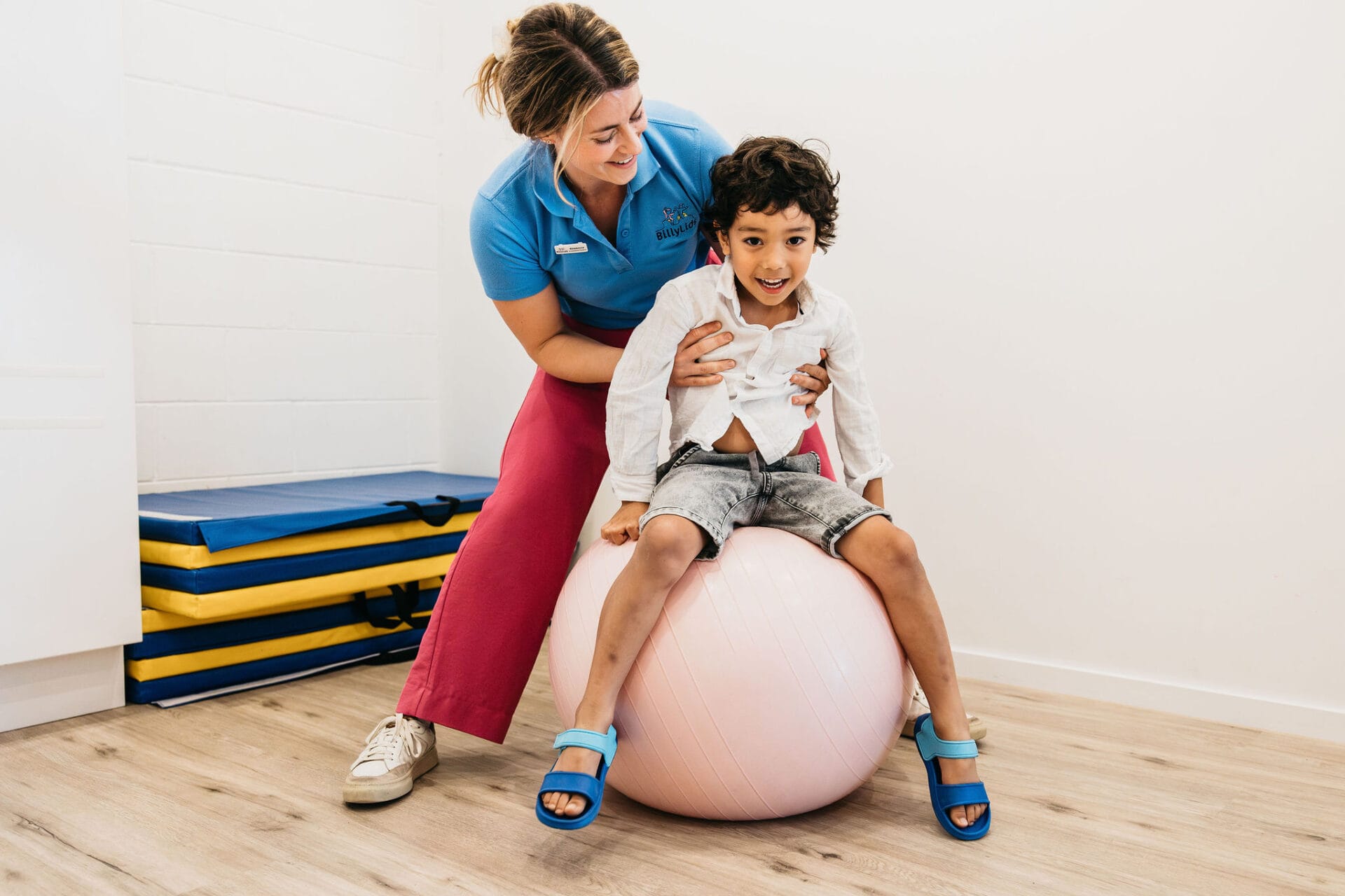 child bouncing on a ball