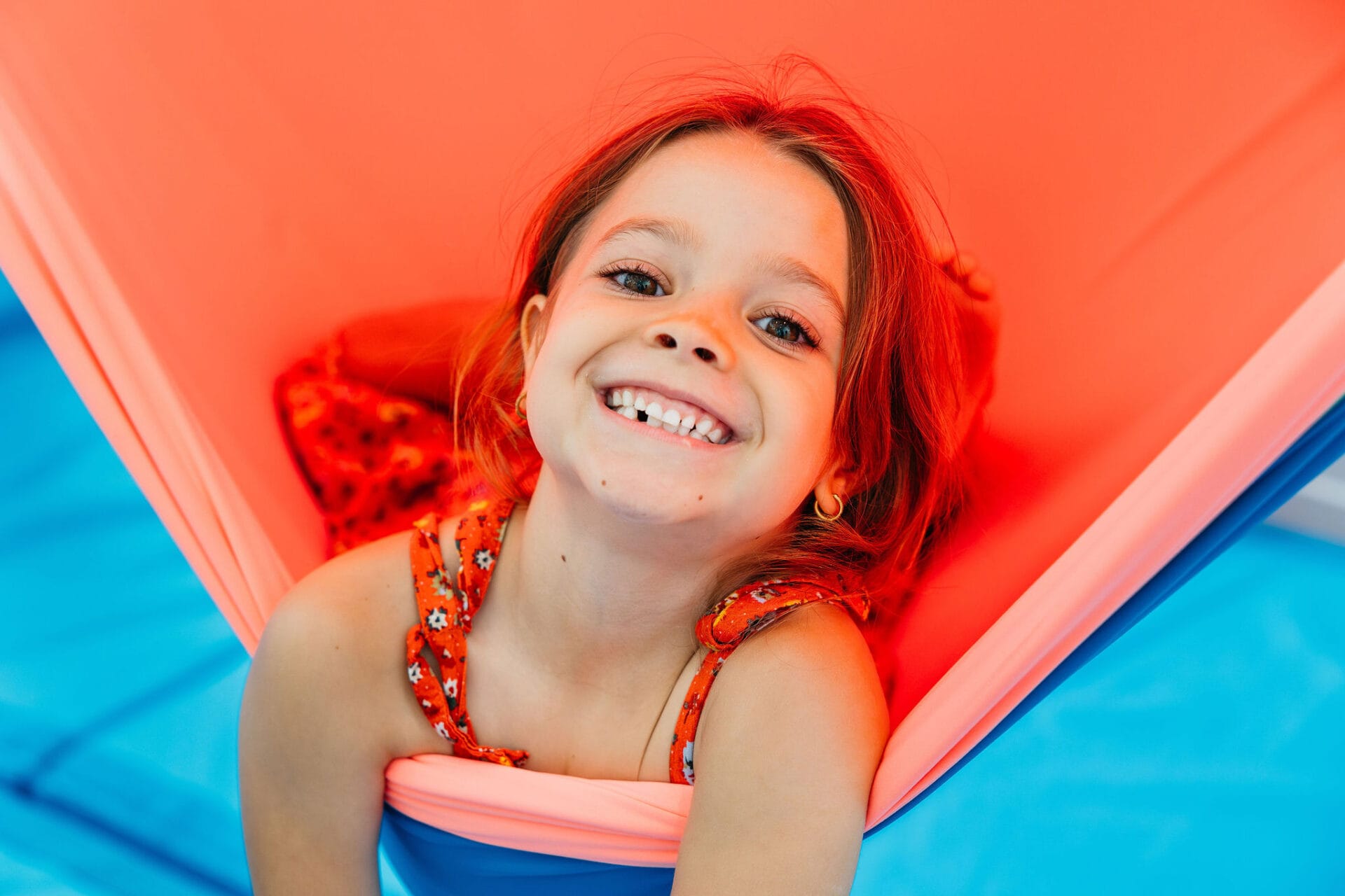 norman-park-child-smiling-in-sensory-swing