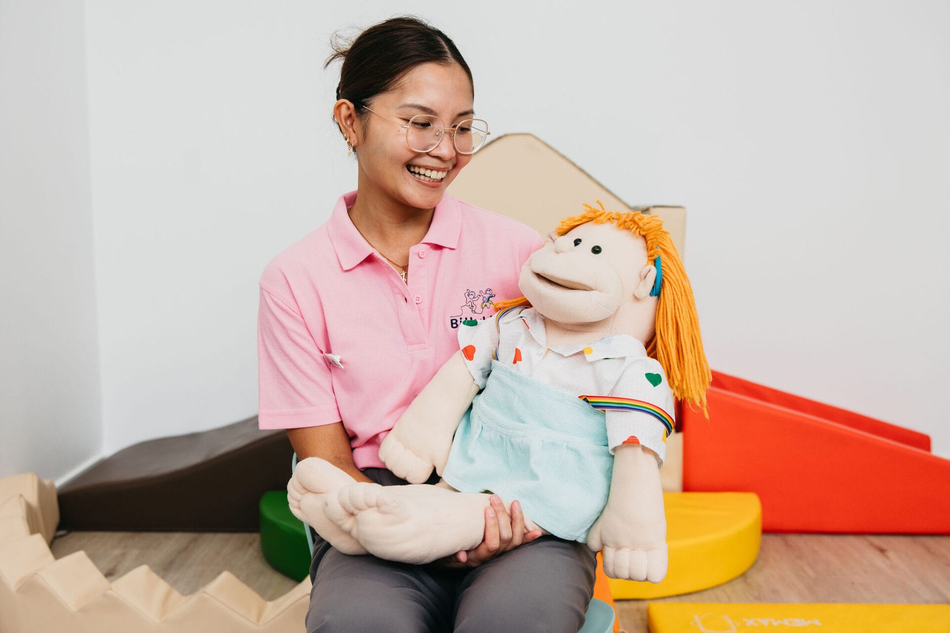 norman-park-therapist-seated-with-puppet-portrait